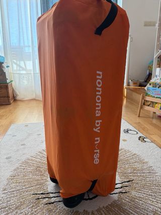 Cuna de viaje naranja con ositos