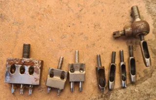 Máquina para ojales, remaches y botones.