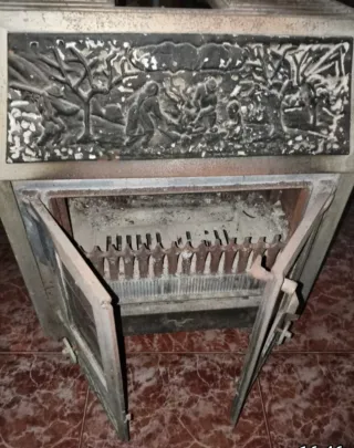 VENDO ESTUFA DE LEÑA DE HIERRO COLADO.
