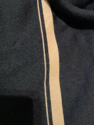 Jersey cuello alto sin mangas