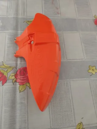 Protector cabezal desbrozadora Stihl naranja