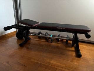 Banco de pesas con mancuernas y barra