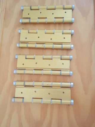 Bisagras doble acción doradas