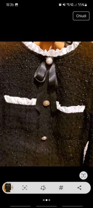 Abito nero con perle e fiocco