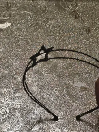 Diadema con estrella plateada