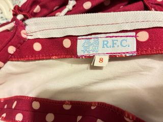 Traje de flamenca burdeos con lunares rosa pastel