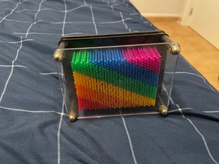 Juguete de relajación con bolitas de colores