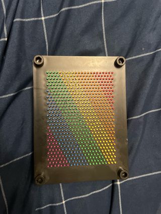 Juguete de relajación con bolitas de colores