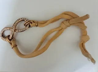Bracciale infinito beige oro zirconi