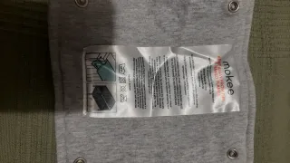 Protector de cuna gris