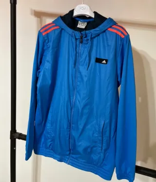Chaqueta cortavientos Adidas azul y naranja