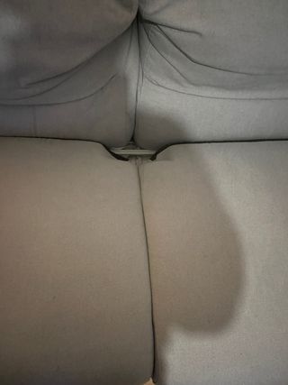 Sofá-cama gris de tela