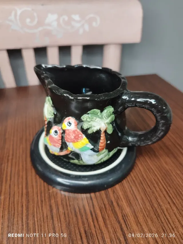 Juego de té de cerámica con loros