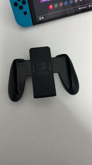 Nintendo Switch OLED Neon + Juegos preguntar