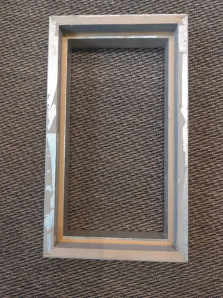 Marco de madera y acabado pan de plata