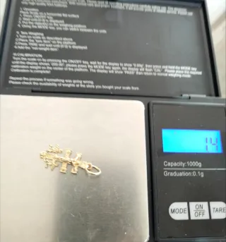 Cruz de oro 18k 1,40 gr