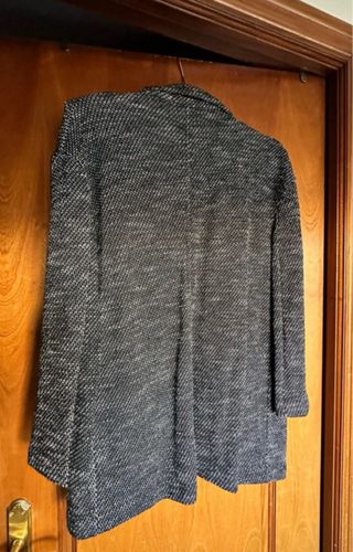 Americana jaspeada de  punto.