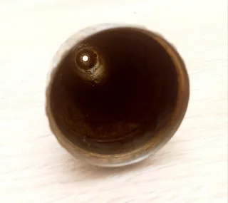 Protector de antigua espoleta de bronce