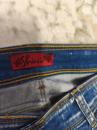 Jeans donna con strass e sfumatura