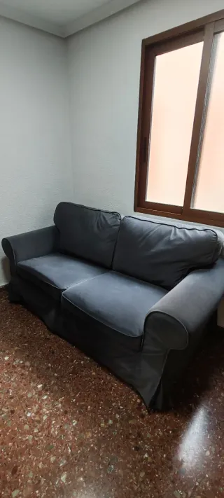 Sofá gris de tela como nuevo