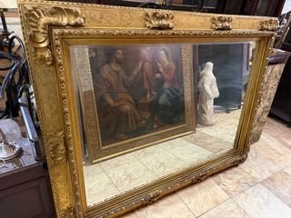 Espejo grande dorado con marco tallado