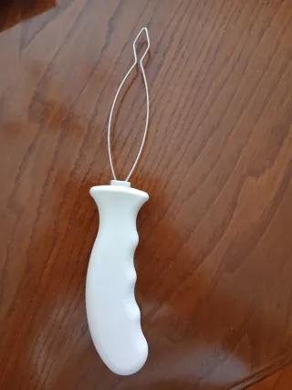 Auxiliar para enfiar botões