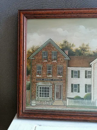 Marco de madera grande con escena de pueblecito