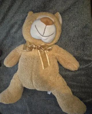 Peluche de osito con lazo dorado