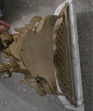 Reloj antiguo de bronce con figuras