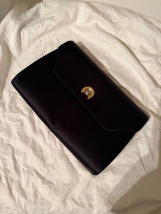 Pochette Fiamma vintage pelle nera e oro