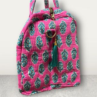 Bolso de viaje estampado rosa y turquesa