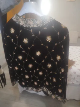 Chaqueta de fiesta negra y dorada