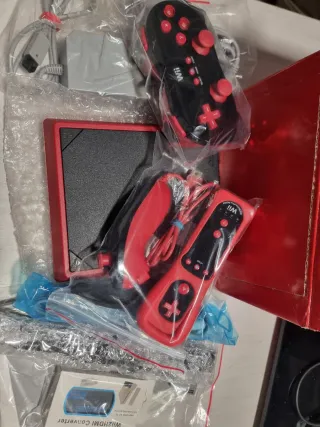 Wii Mini Roja Española con mandos originales.