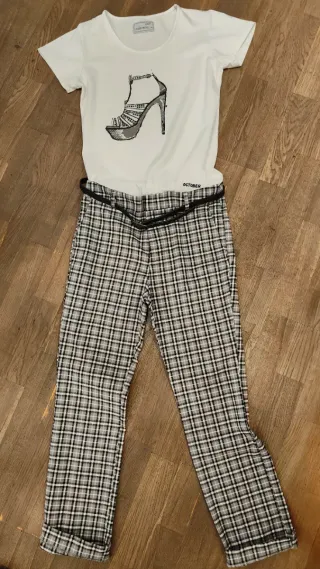 Pantalón de cuadritos nuevo y camiseta estrenada.