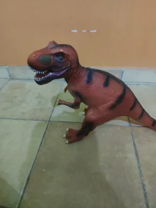 Dinosaurio de juguete T-Rex naranja