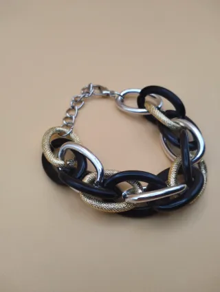 Pulsera eslabones dorados ,plateado y negros