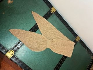 Sciarpa lavorata a maglia color sabbia