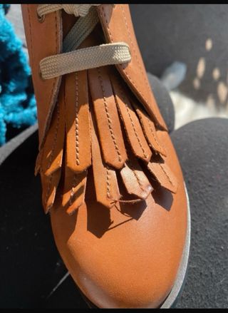 Botines de piel con flecos