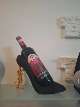 Porta bottiglia a forma di decolte