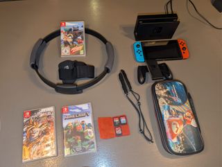 Nintendo Switch + Ring Fit + 6 juegos + estuche