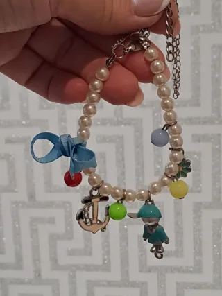 Pulsera perlas y plata con charms