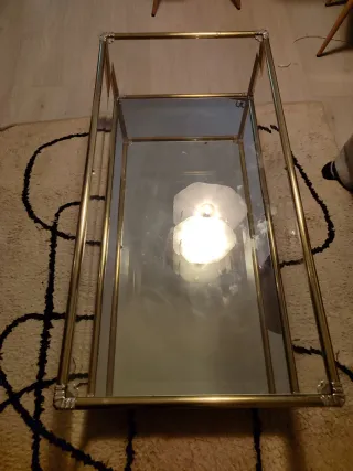 Mesa centro cristal y metal dorado