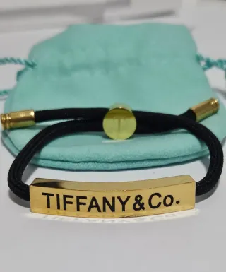 Pulsera Tiffany & Co. Negra y Dorada