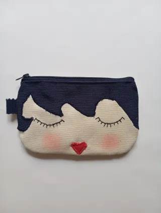 Monedero con cara y corazón