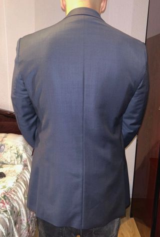 Chaqueta de traje negra con forro rojo