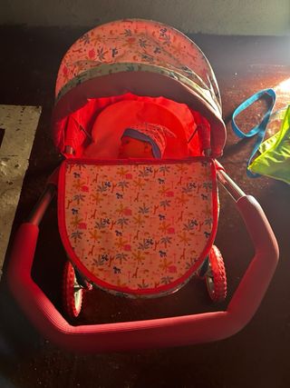 Carrito de muñecas rosa