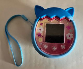 Tamagotchi Pix Rosa con Funda Azul