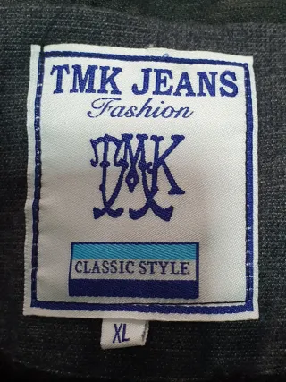 Chaqueta doble capa gris medidas axilas  60 por 87