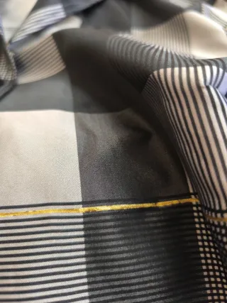 Chaqueta de vestir gris y dorada y negra