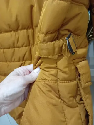 Plumífero caballero naranja y negro